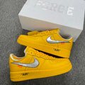 Yellow Air Force 1 sneakers with white swoosh and 'AIR' text, shown with box