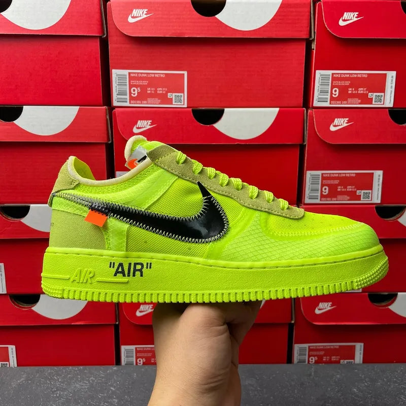 Neon green low-top sneaker with black swoosh and textured lace panel