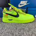 Neon green low-top sneaker with Nike swoosh and 'AIR' on the midsole