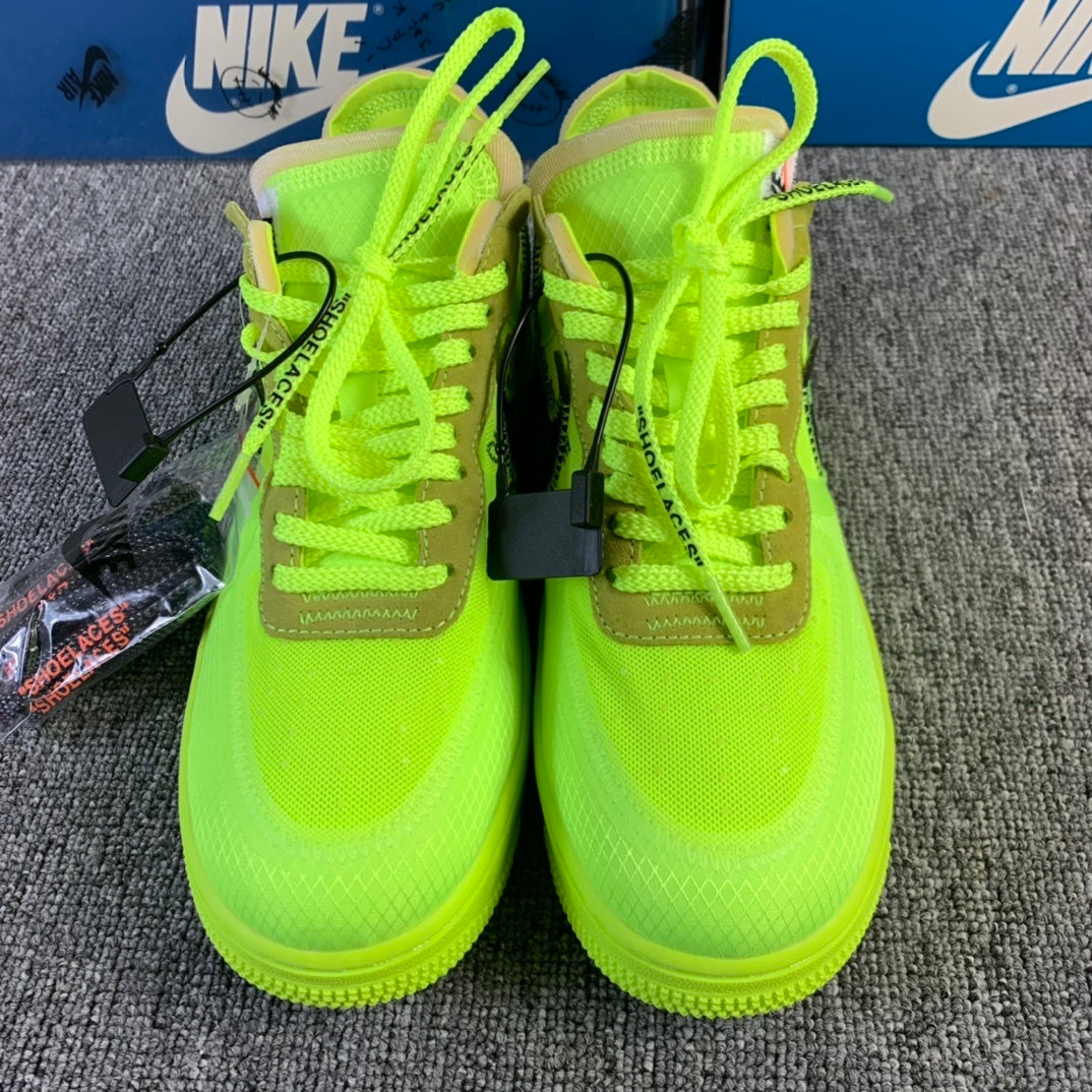 Neon green low-top sneakers pair with lace-up uppers and hanging accessory tag