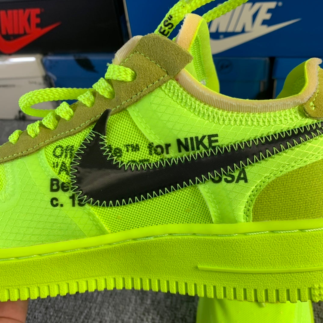 Neon green sneaker upper with 'for NIKE' text detail and stitched trim