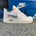 White low-top sneaker with silver swoosh and "AIR" text on the side