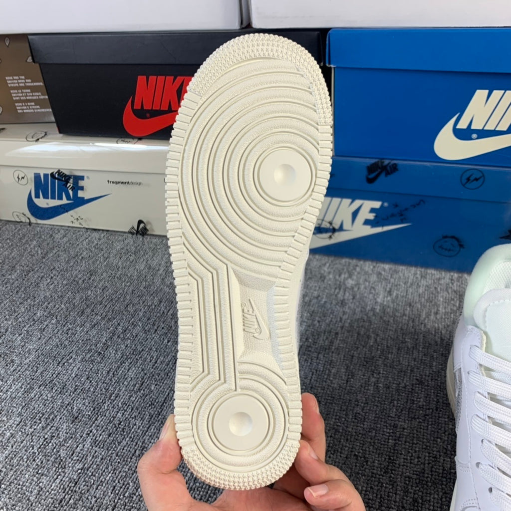 White sneaker outsole with textured tread and circular traction pattern