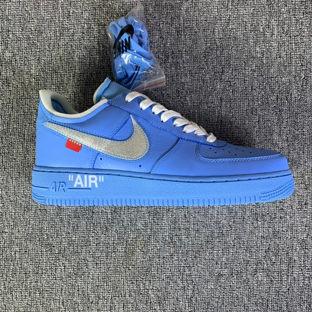 Blue low-top sneakers with swoosh, white laces, and AIR midsole text
