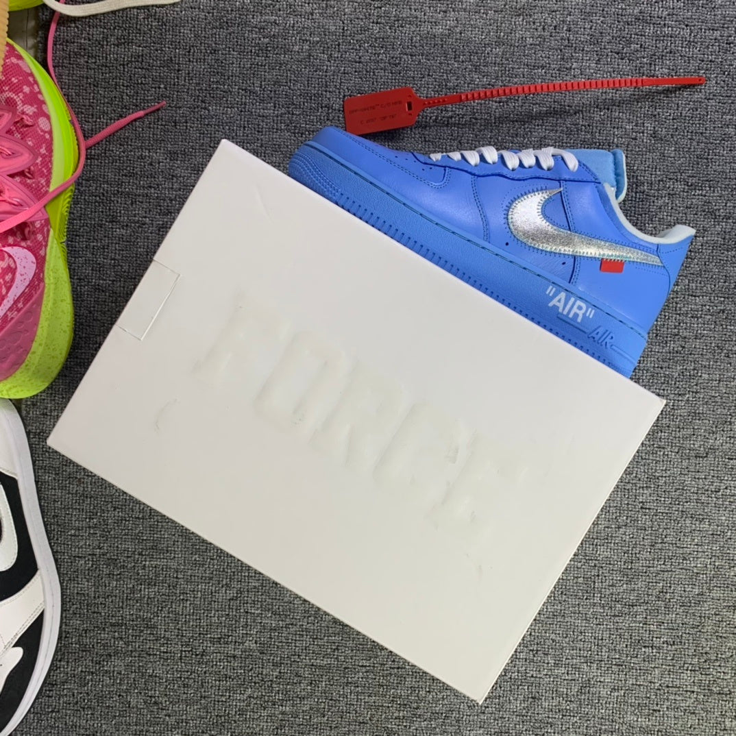 Blue low-top sneakers on white packaging papers with red tag