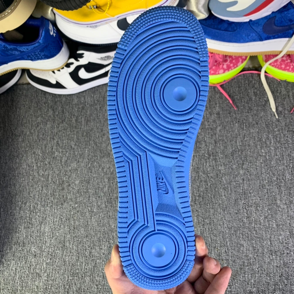 Blue rubber outsole with circular traction pods and tread pattern
