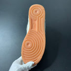 Sail sneaker outsole with orange rubber tread