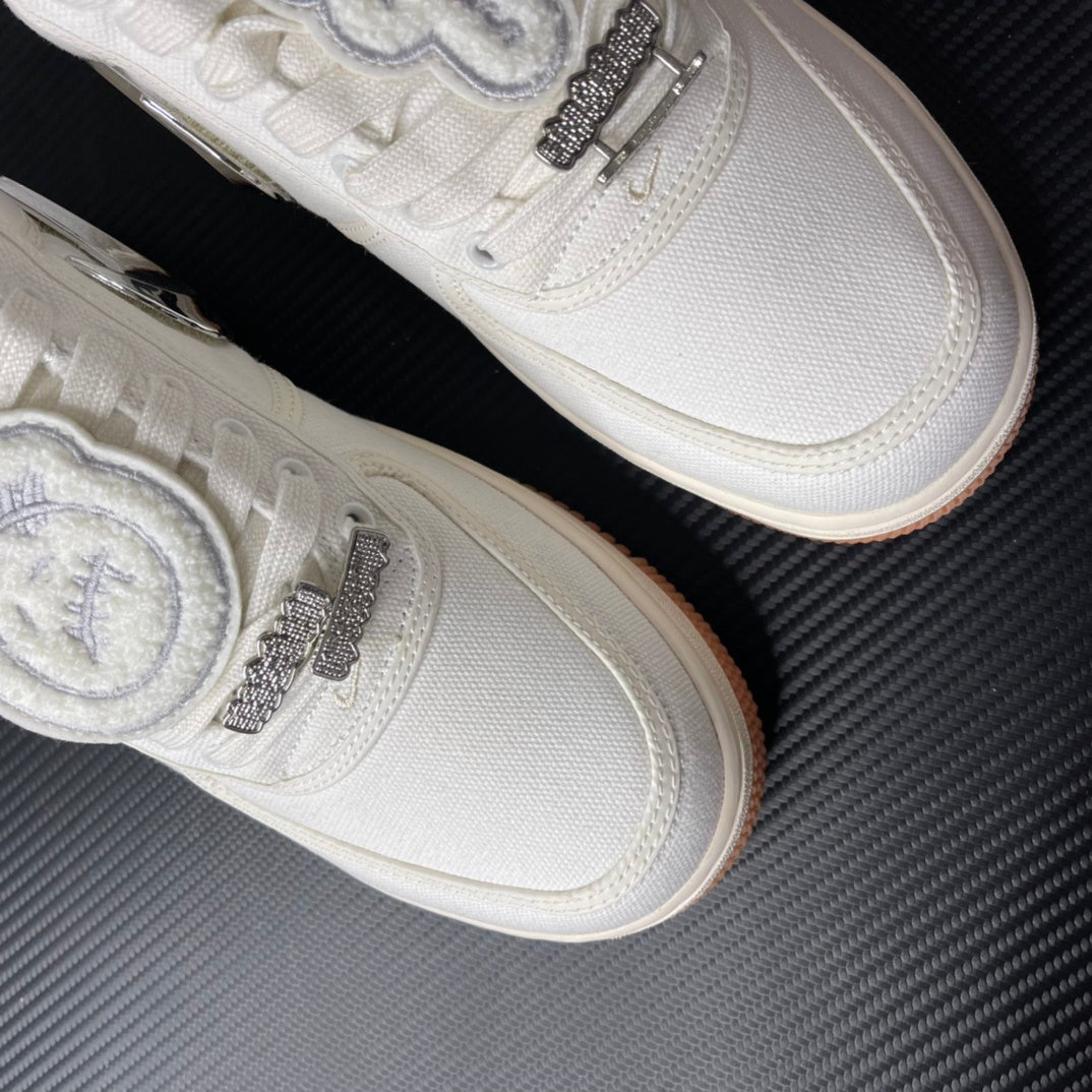 Low-top sneakers in sail with chrome swoosh and sparkly lace accents