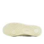 Light tan rubber outsole with raised traction pattern