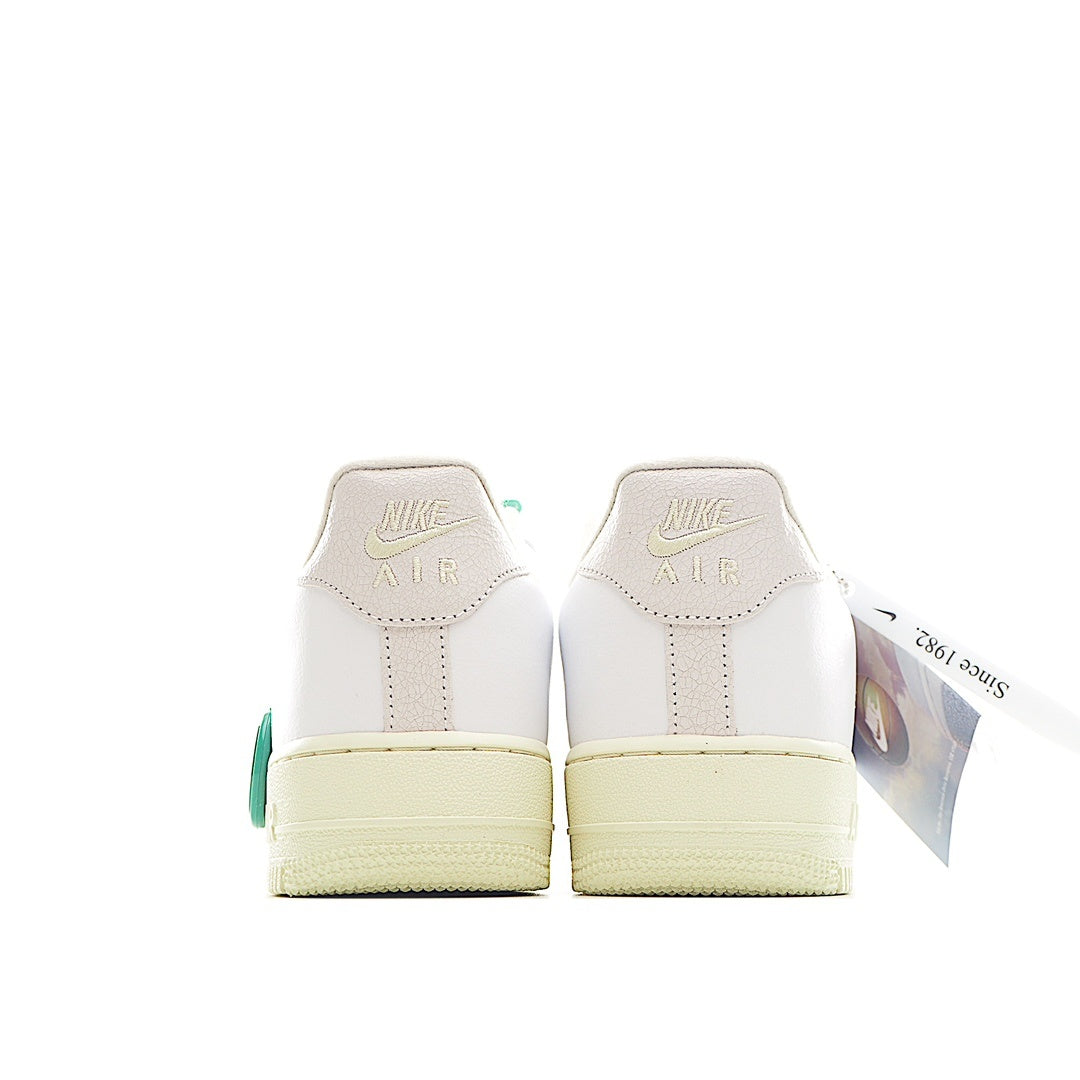 White low-top sneaker with Nike Air heel text and tan gum sole