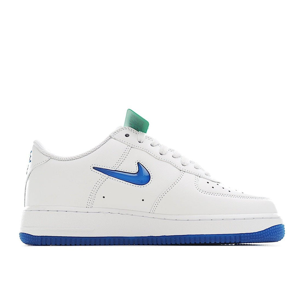 White Nike Air Force 1 low-top sneaker with blue swoosh and teal tag