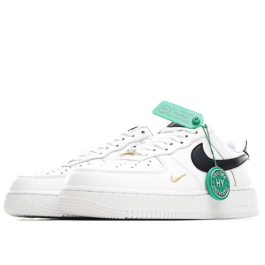 White leather sneaker with black Swoosh, gold accent, and green HY authenticity tag