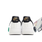 White sneaker heel with black back panel, Nike Air text, and green HY tag