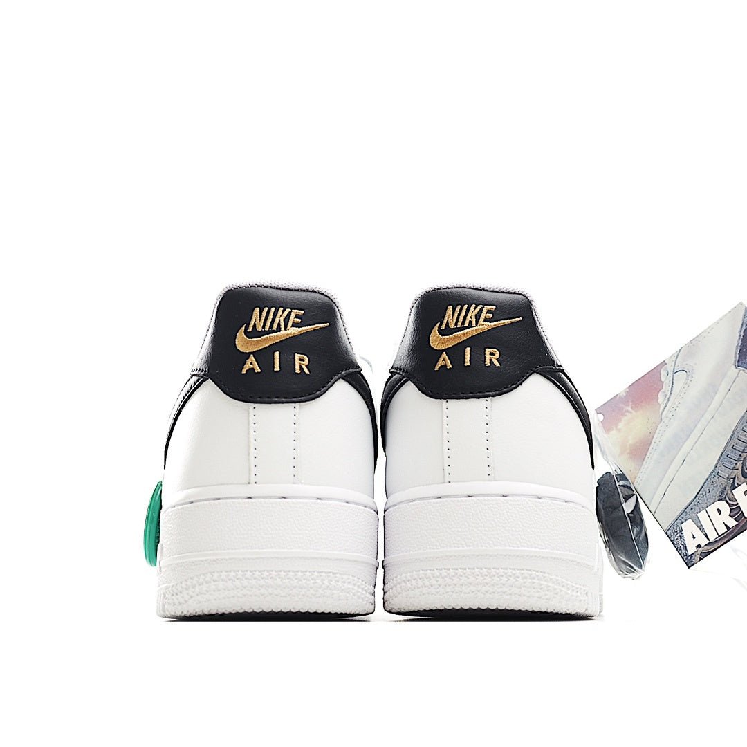 White sneaker heel with black back panel, Nike Air text, and green HY tag
