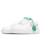 Nike Air Force 1 sneaker, white upper with beige swoosh and gold detail, green tag