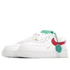Nike Air Force 1 sneakers, white upper with red swoosh and green hang tag