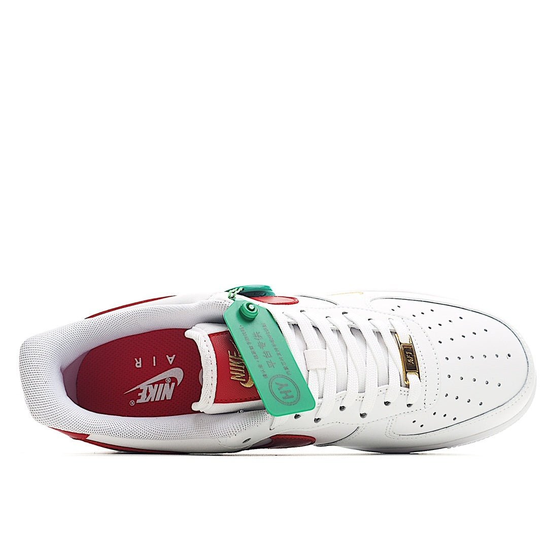 Nike Air Force 1 sneakers, white with red interior, green tag on laces
