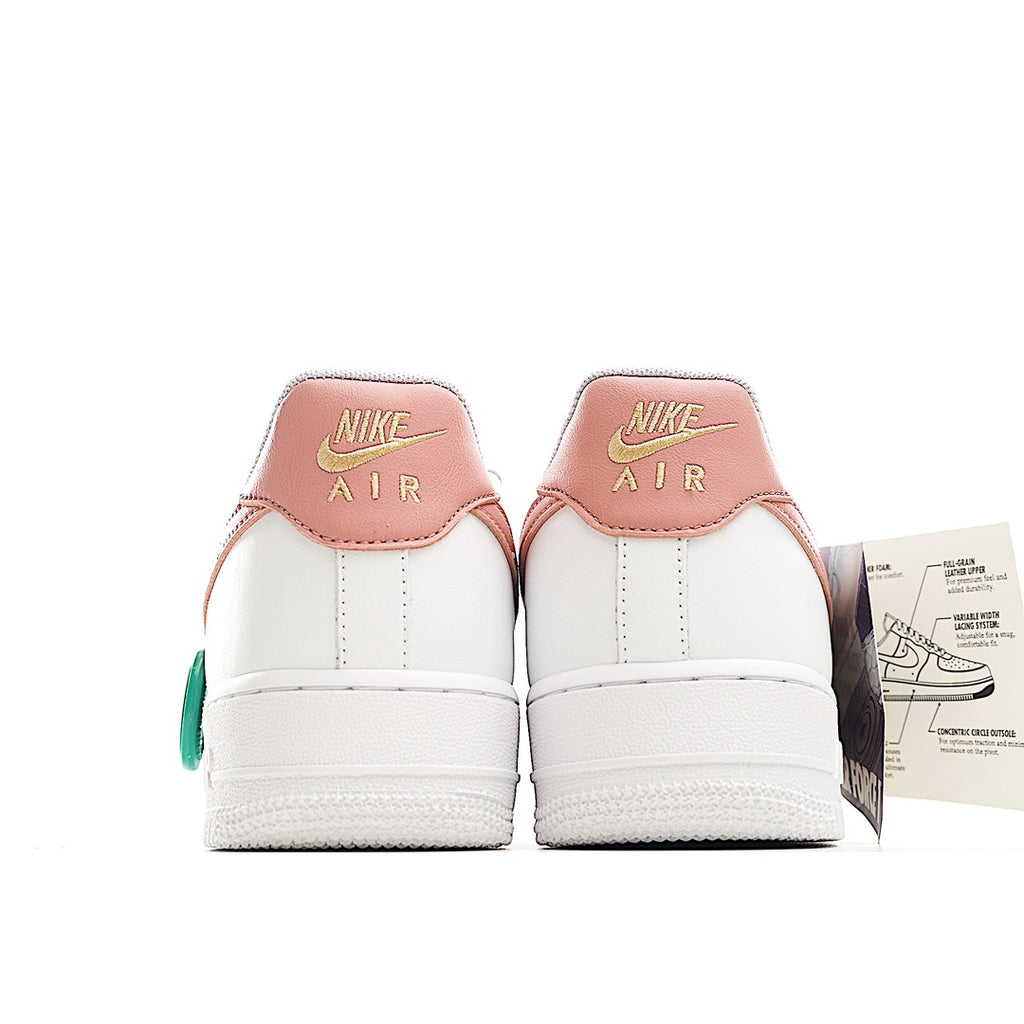 Nike Air Force 1 low-top sneakers, white with pink heel panels and white soles