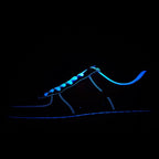Nike Air Force 1 sneakers with dark upper and bright blue glowing lace and trim