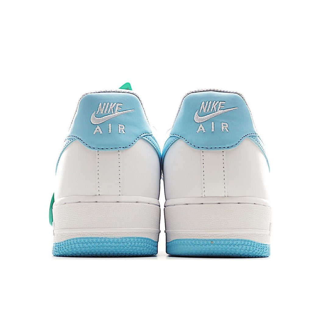 Pair of white sneakers with light-blue heel panels and blue sole