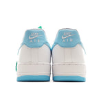 Pair of white sneakers with light-blue heel panels and blue sole
