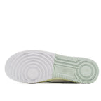 Rubber outsole for white Air Force 1 with circular tread and green sidewall details.
