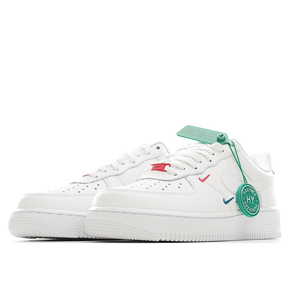 Nike Air Force 1 sneakers, white leather with blue and red swooshes and green tag