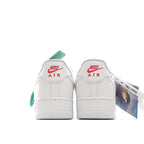 Nike Air Force 1 sneakers, white leather with Nike Air heel branding and green tag