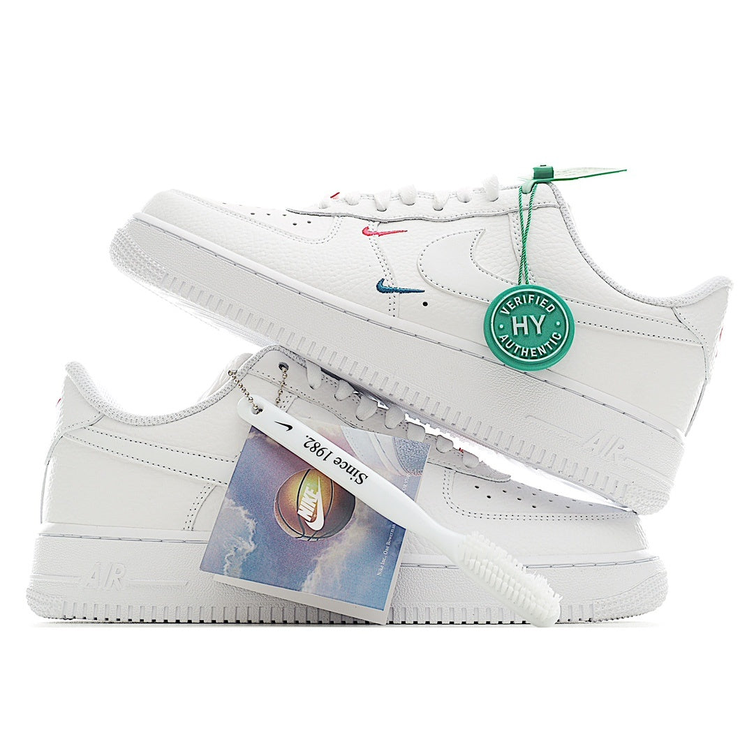 Nike Air Force 1 sneakers, white leather with blue/red swooshes and blue product tag