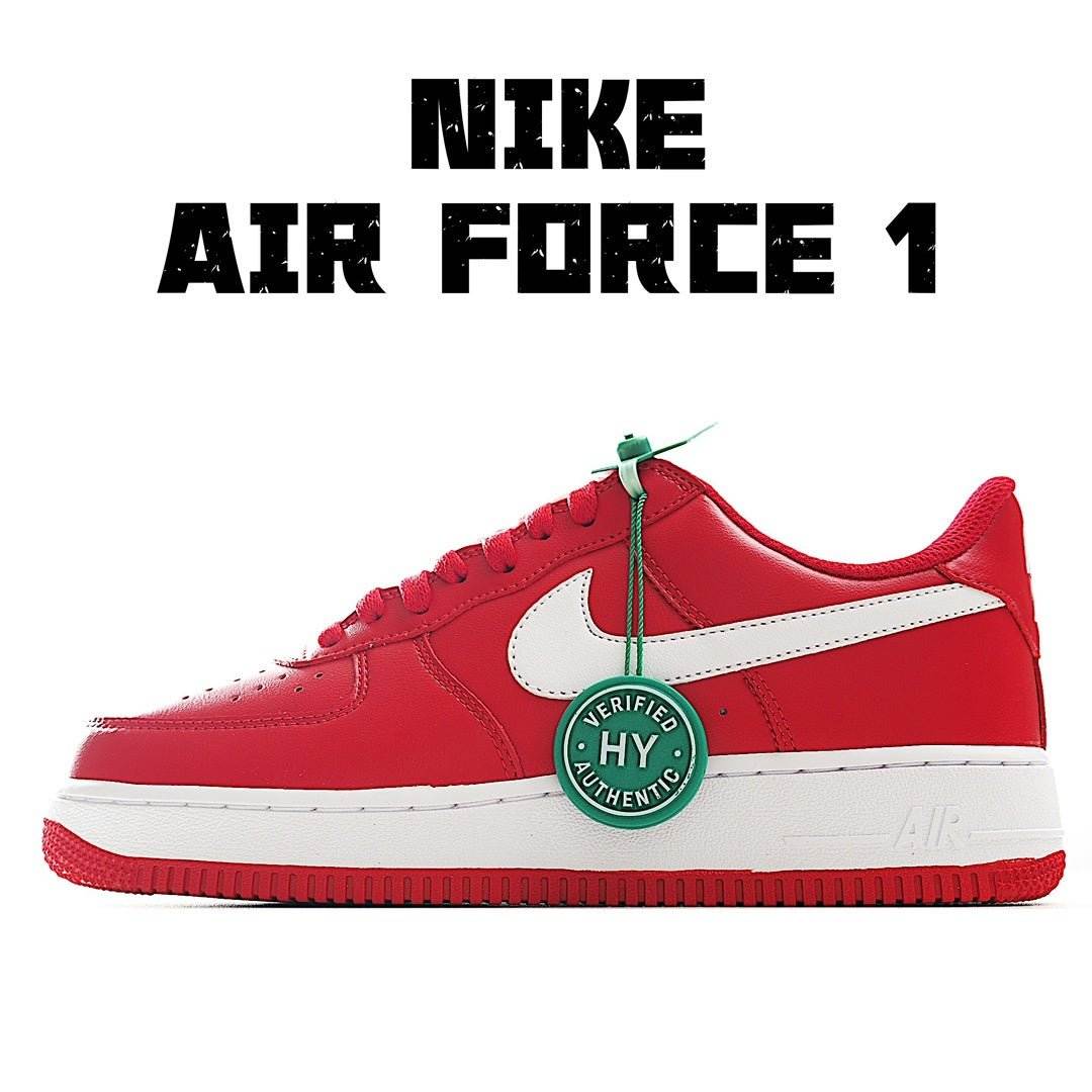 Red Nike low-top sneaker with white swoosh, green HY tag and lace eyelets