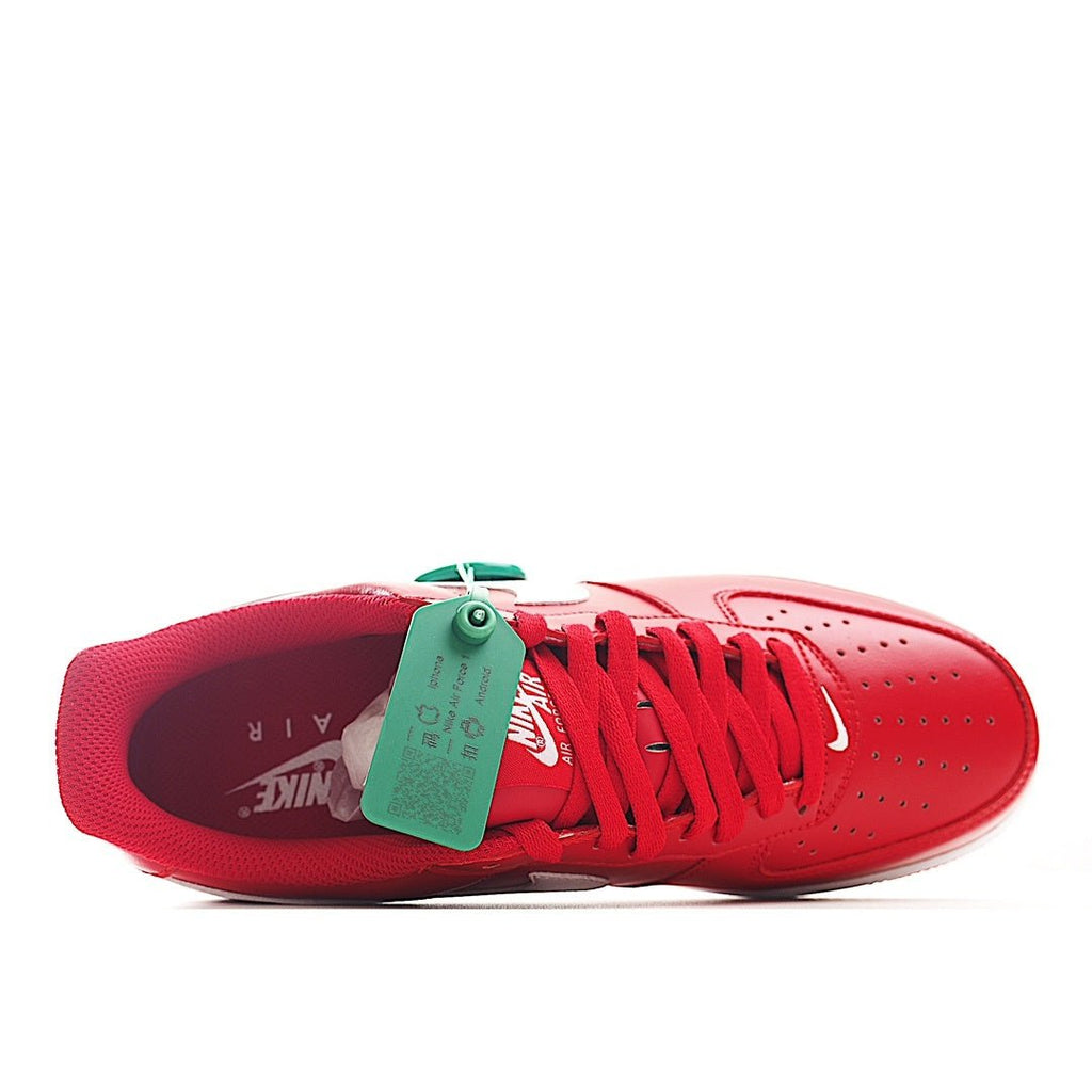 Red sneaker interior and outsole view with red laces and green hang tag