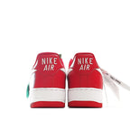 Pair of red sneakers with white midsoles and back heel Nike Air branding