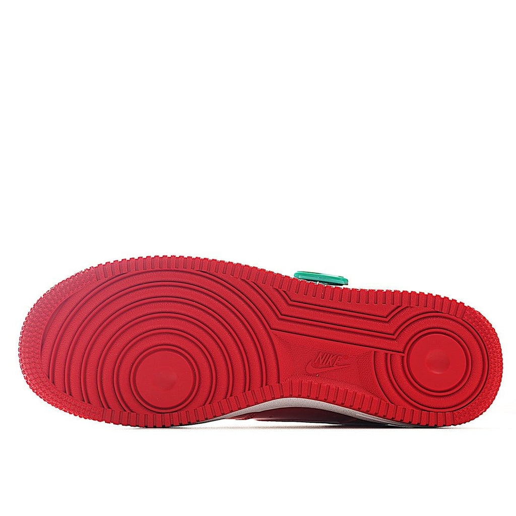 Red rubber sneaker outsole with circular tread pattern and Nike logo