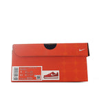 Orange Nike shoebox with label sticker and swoosh logo