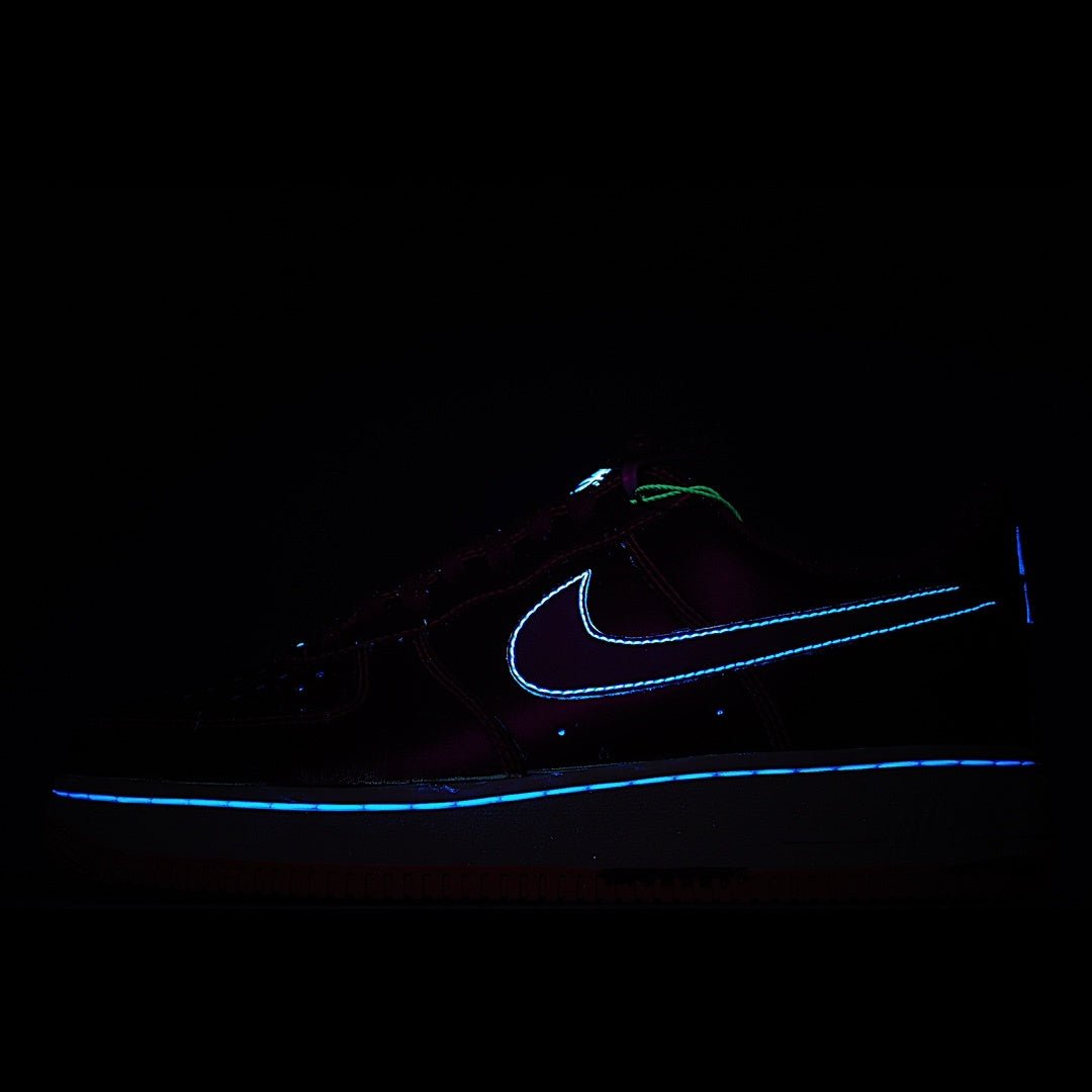 Dark sneakers with glowing blue Nike swoosh and outline on a black background