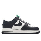 Black-and-white Nike Air Force 1 sneakers with green hang tag, low-top lace-up