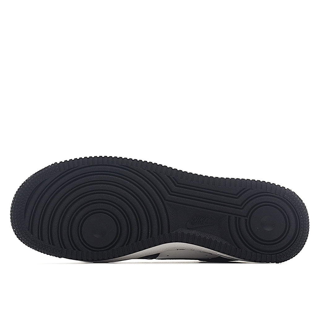 Black Nike Air Force 1 rubber outsole with circular traction tread pattern