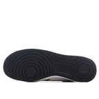 Black Nike Air Force 1 rubber outsole with circular traction tread pattern