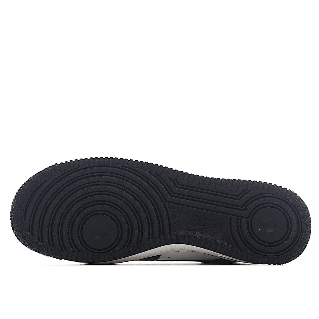 Black Nike Air Force 1 rubber outsole with circular traction tread pattern