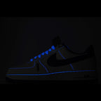 Nike Air Force 1 sneakers in dark color with bright blue trim and Air branding