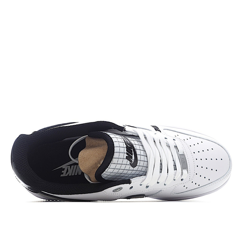 White low-top sneaker interior with dark lining and tongue branding, side view.