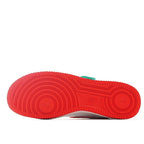 Red Air Force 1 outsole tread view with circular traction pattern