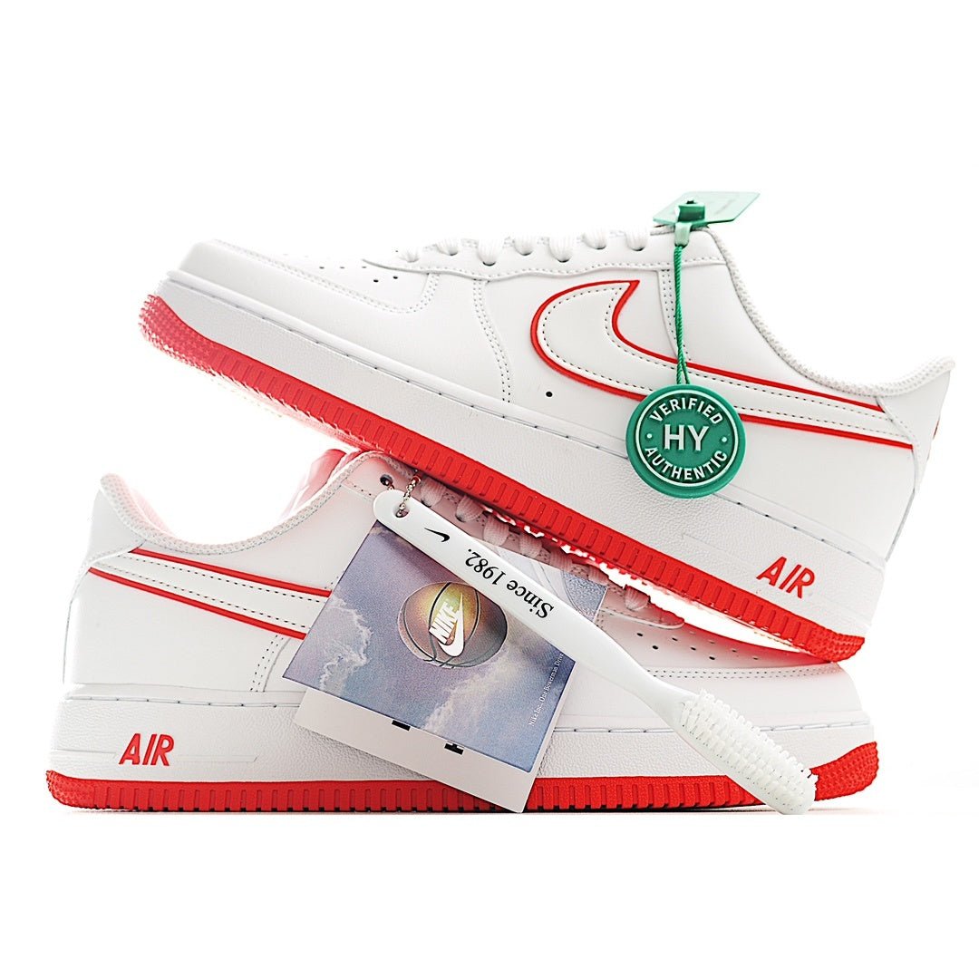 White Air Force 1 sneaker with green tag and red outsole, showing side profile