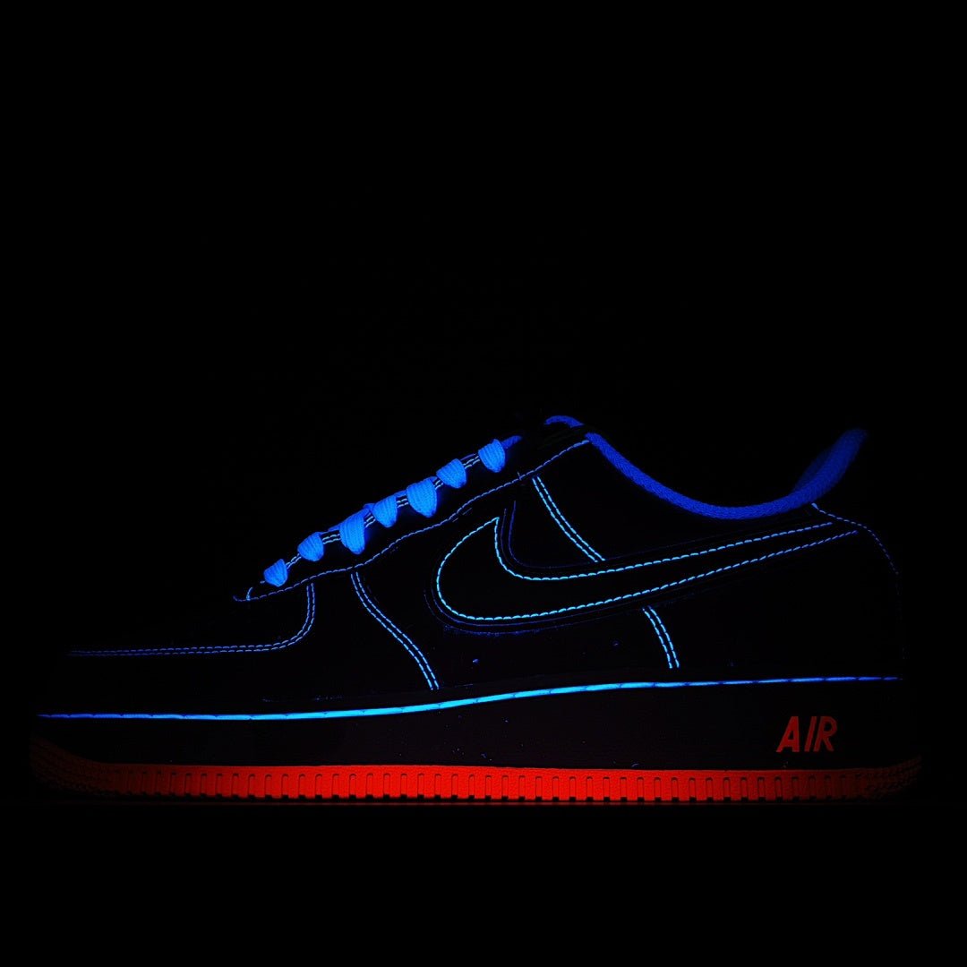 Dark blue Nike Air sneaker with blue neon trim and red “AIR” heel stripe
