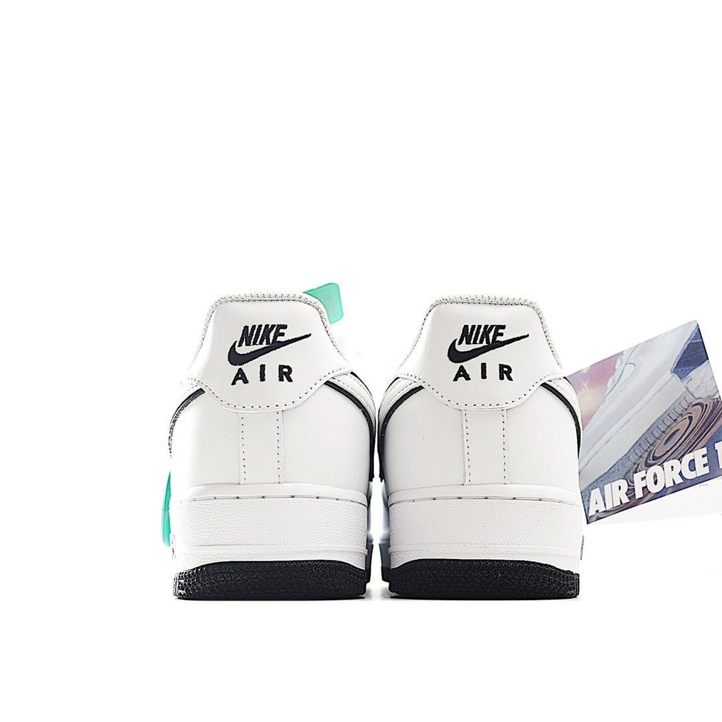 Back view of white Air Force 1 low-top sneakers with Nike Air heel tabs
