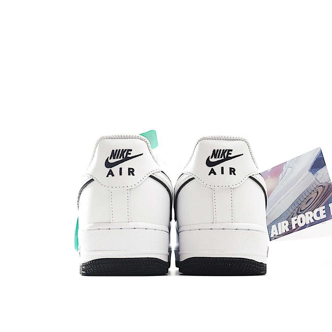 Back view of white Air Force 1 low-top sneakers with Nike Air heel tabs