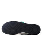 Black rubber outsole of low-top sneakers with circular tread pattern