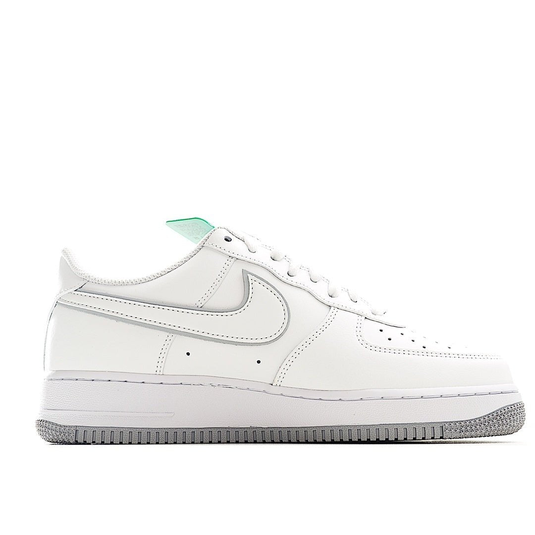 Nike Air Force 1 sneakers, white leather upper with swoosh and green collar tab