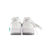 Nike Air Force 1 sneakers, white leather heel view with Air logo and green pull tab