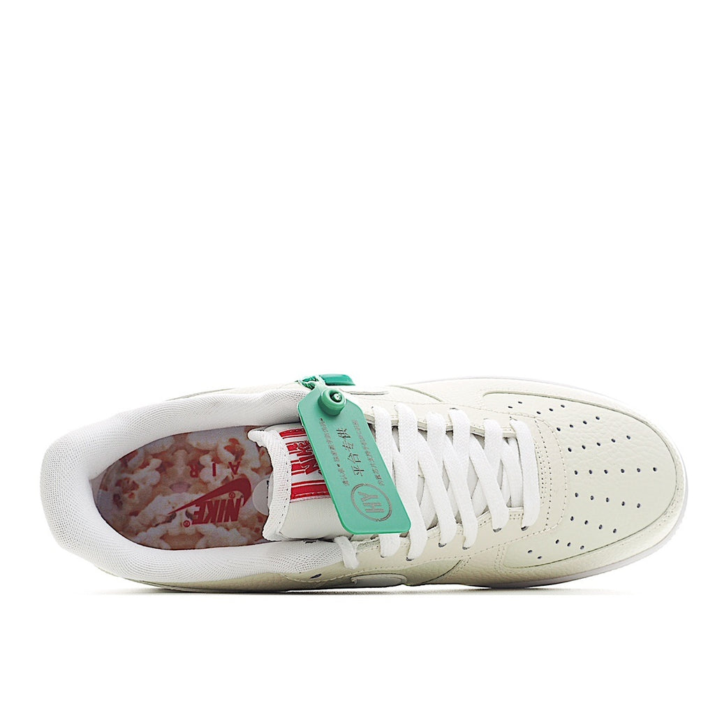 White Nike Air Force 1 sneakers, inside view of upper, green tag